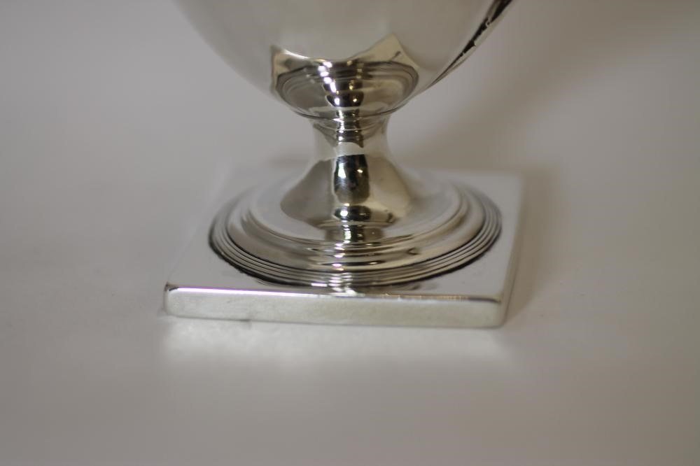 A GEORGE III SILVER PEDESTAL MILK JUG Image