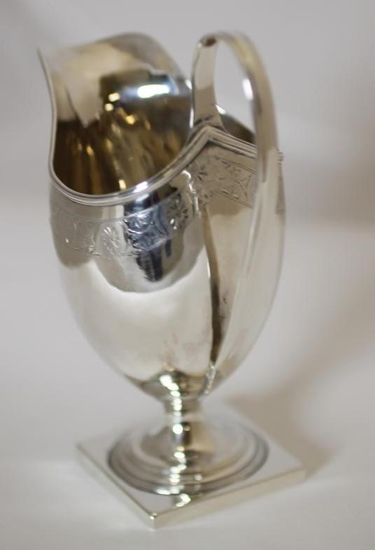 A GEORGE III SILVER PEDESTAL MILK JUG Image