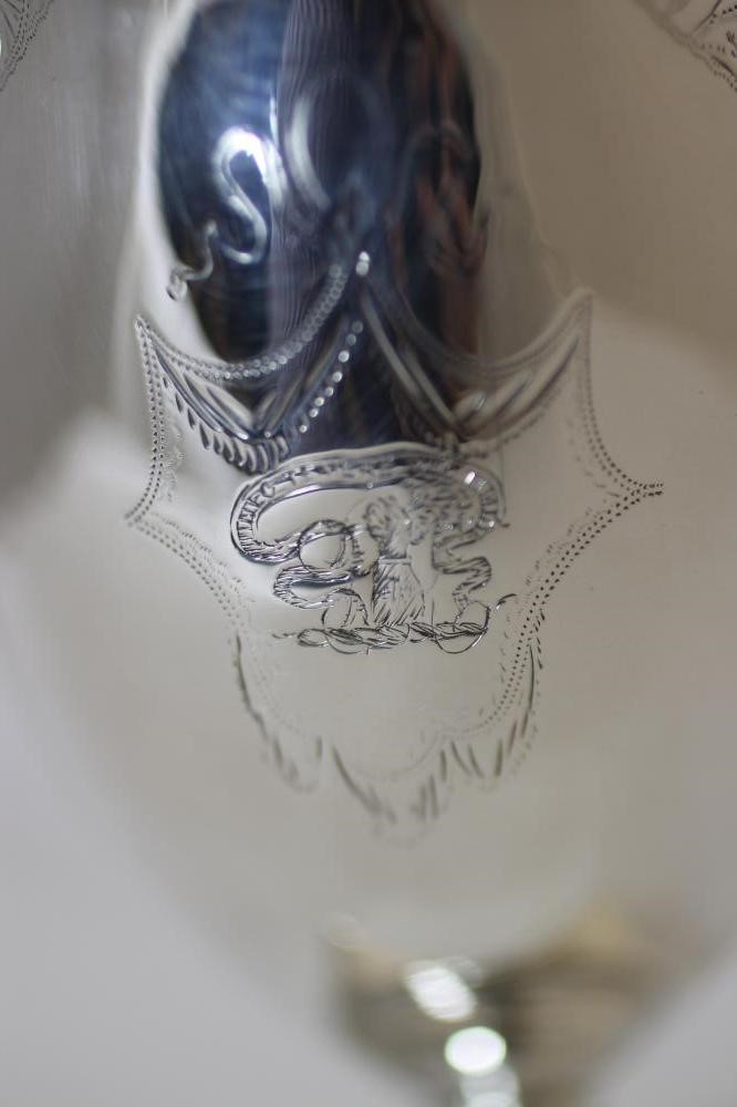 A GEORGE III SILVER PEDESTAL MILK JUG Image