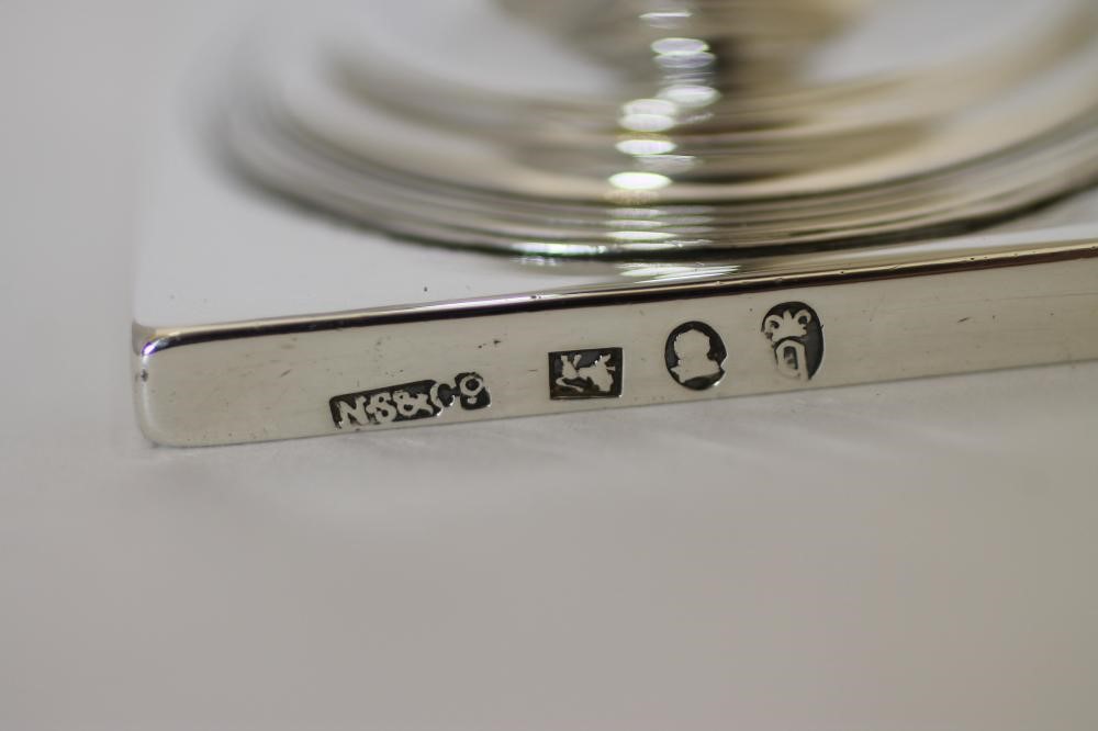 A GEORGE III SILVER PEDESTAL MILK JUG Image