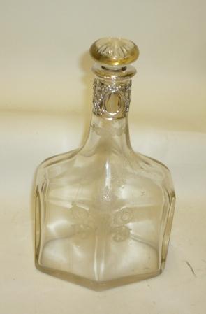 AN EDWARDIAN GLASS AND SILVER DECANTER Image