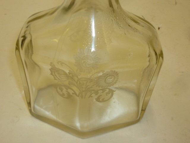 AN EDWARDIAN GLASS AND SILVER DECANTER Image