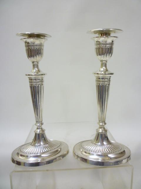 A PAIR OF EDWARDIAN SILVER CANDLESTICKS Image