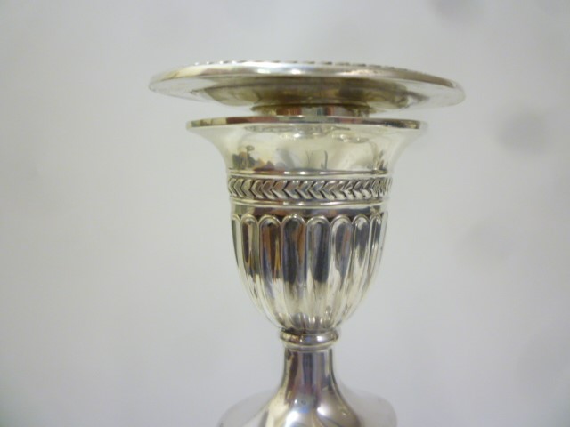 A PAIR OF EDWARDIAN SILVER CANDLESTICKS Image