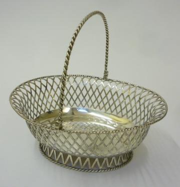 AN EDWARDIAN SILVER SWEETMEAT BASKET Image
