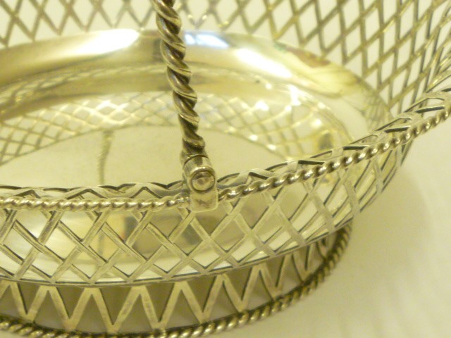 AN EDWARDIAN SILVER SWEETMEAT BASKET Image
