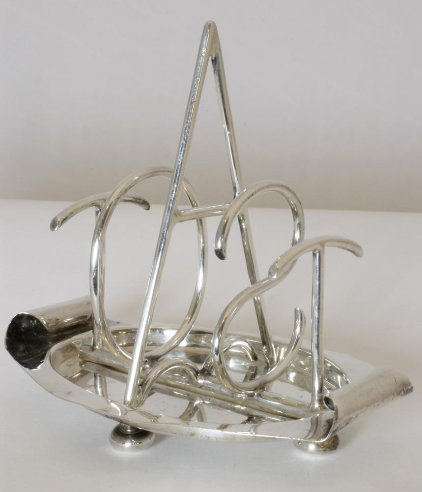 A LATE VICTORIAN NOVELTY SILVER TOASTRACK Image