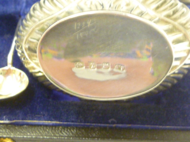 A PAIR OF LATE VICTORIAN SILVER SALT BASKETS Image