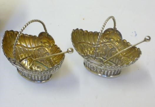 A PAIR OF LATE VICTORIAN SILVER SALT BASKETS Image