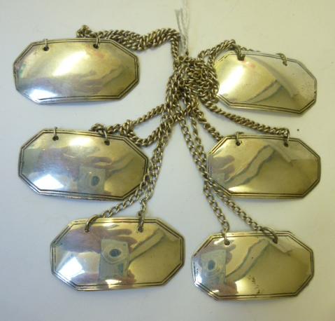 A RARE SET OF SIX GEORGE III SILVER BOTTLE LABELS Image
