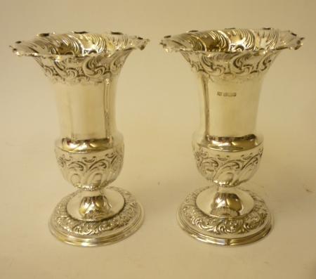 A COMPOSITE PAIR OF EDWARDIAN SILVER PEDESTAL VASES Image