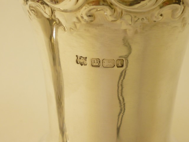 A COMPOSITE PAIR OF EDWARDIAN SILVER PEDESTAL VASES Image