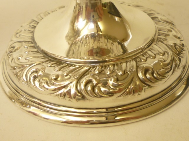 A COMPOSITE PAIR OF EDWARDIAN SILVER PEDESTAL VASES Image