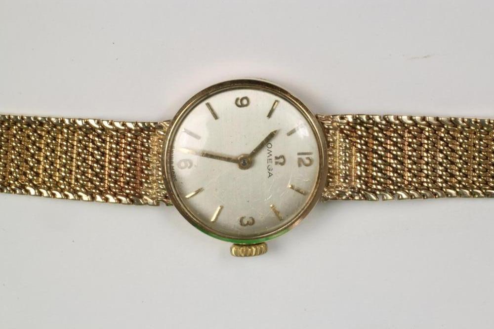 A LADY'S 9CT GOLD OMEGA WRISTWATCH Image