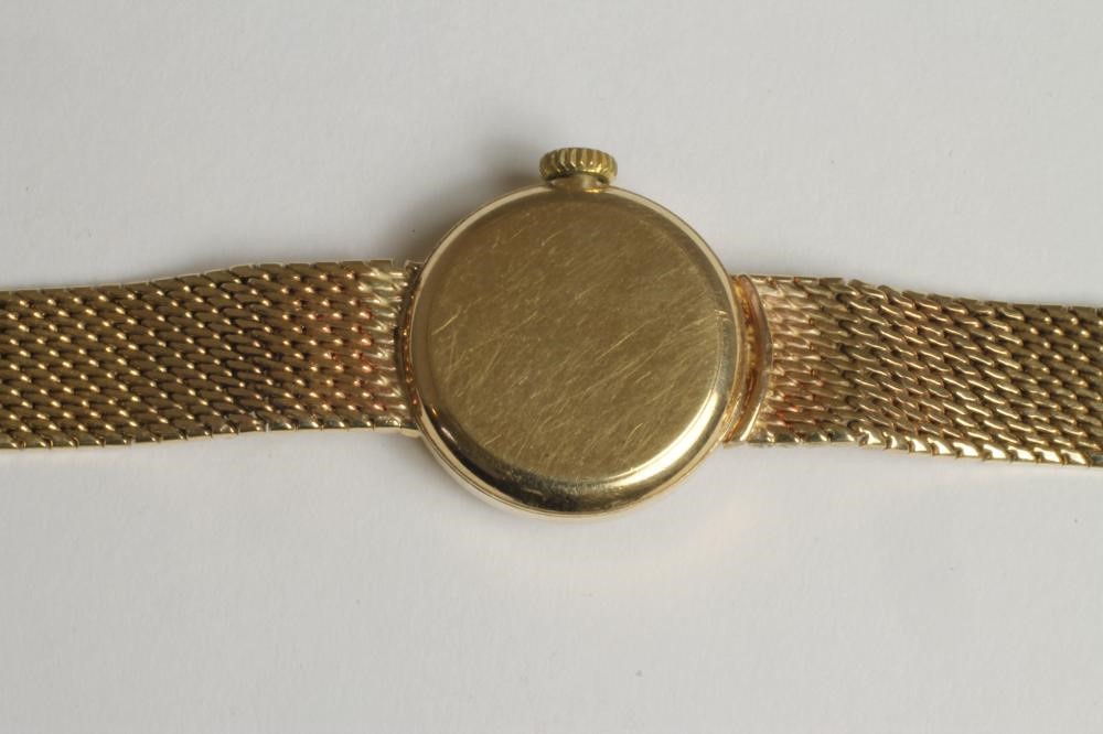 A LADY'S 9CT GOLD OMEGA WRISTWATCH Image