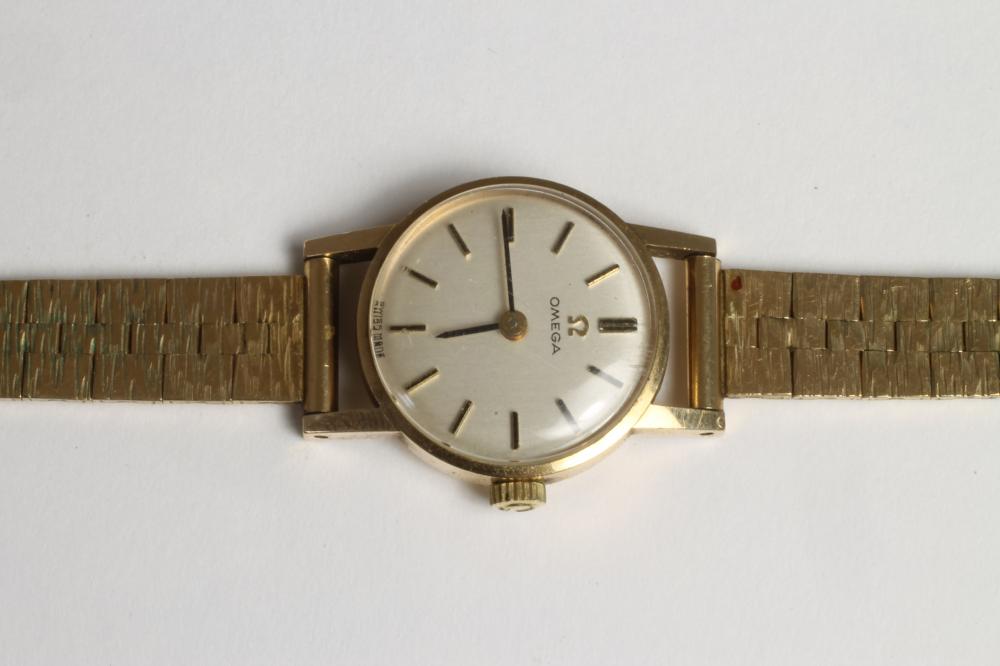 A LADY'S 9CT GOLD OMEGA WRISTWATCH Image