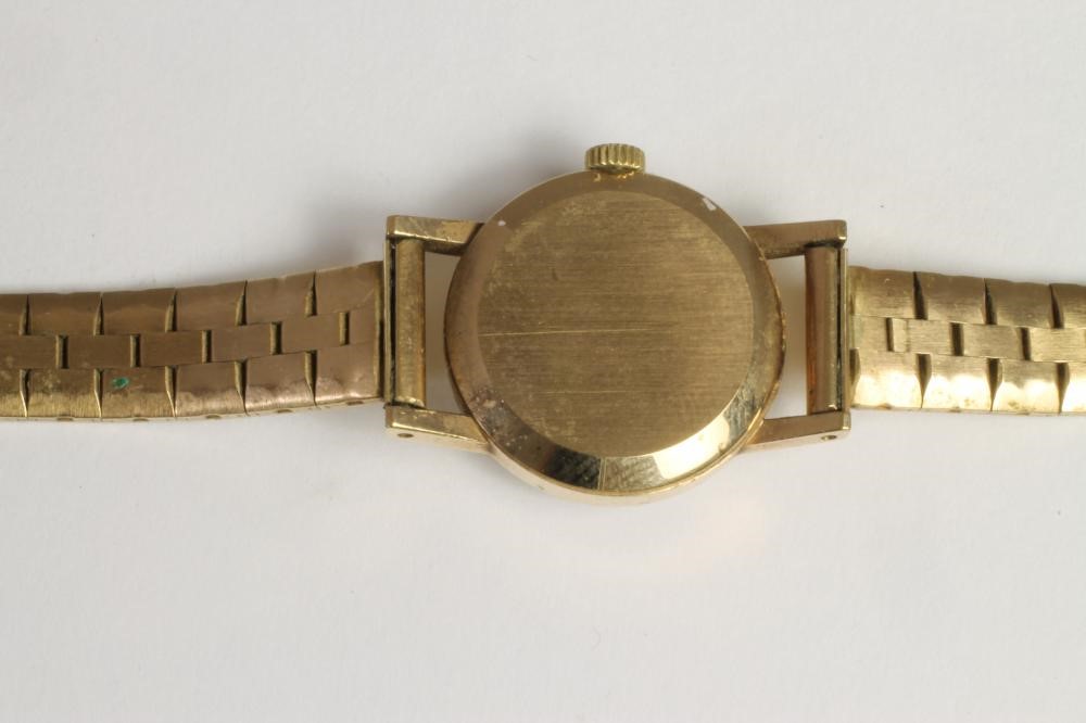 A LADY'S 9CT GOLD OMEGA WRISTWATCH Image