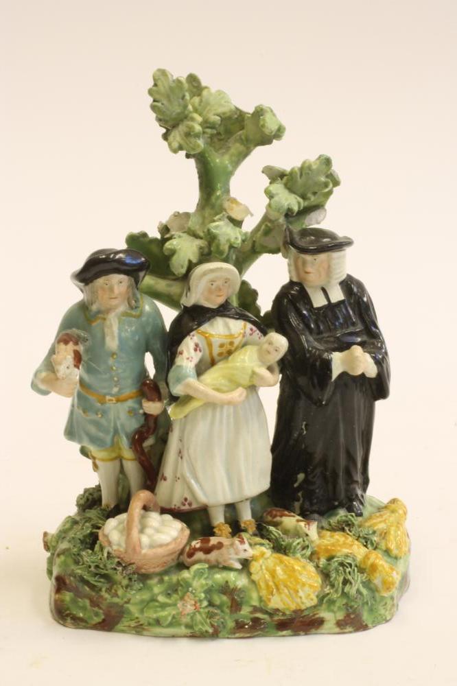 A STAFFORDSHIRE POTTERY "TYTH PIG" FIGURE GROUP Image