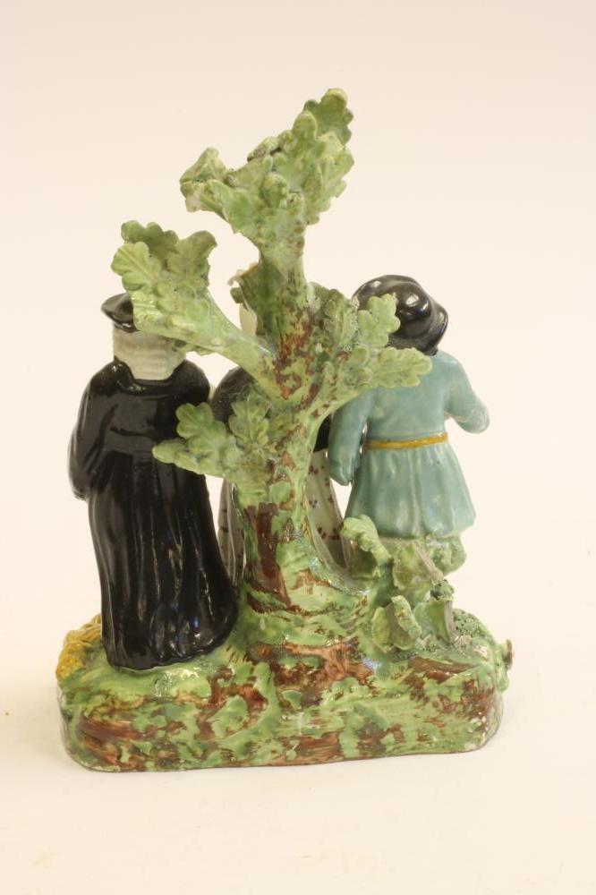 A STAFFORDSHIRE POTTERY "TYTH PIG" FIGURE GROUP Image