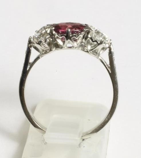 A RUBY AND DIAMOND THREE STONE RING Image