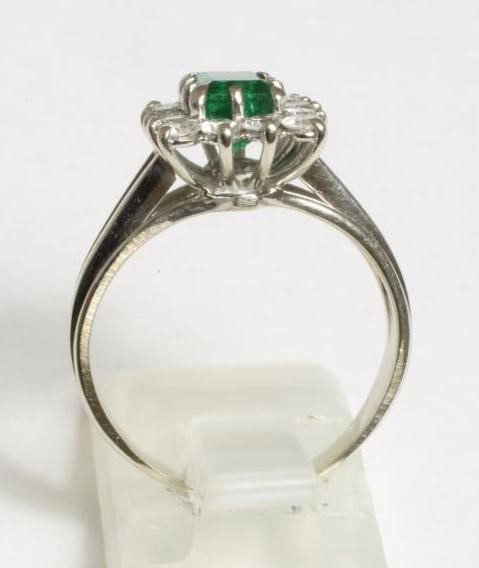AN EMERALD AND DIAMOND PLAQUE RING Image