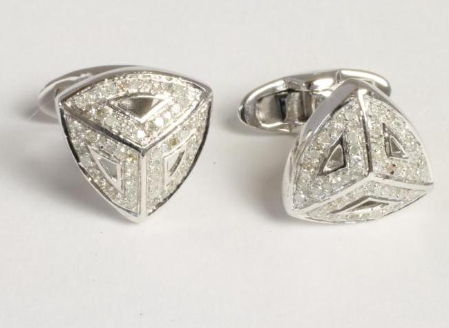 A PAIR OF DIAMOND CUFFLINKS Image