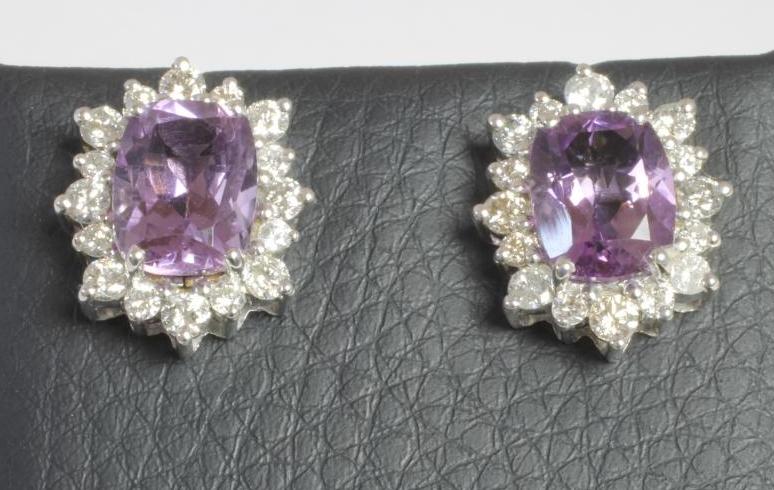 A PAIR OF AMETHYST AND DIAMOND CLUSTER EAR STUDS Image