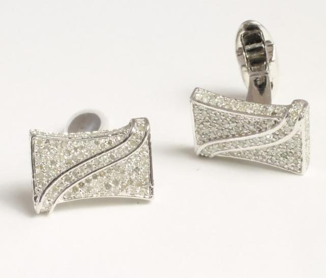 A PAIR OF DIAMOND CUFFLINKS Image