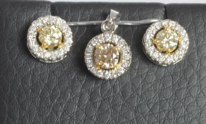 A FANCY YELLOW DIAMOND PENDANT AND MATCHING STUD EARRINGS Image