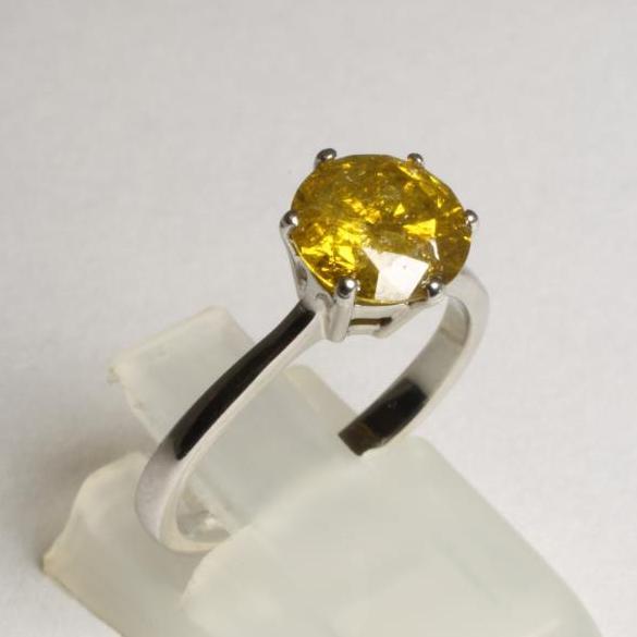 A SOLITAIRE YELLOW DIAMOND RING Image
