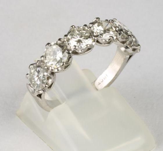 A SIX STONE DIAMOND HALF HOOP RING Image