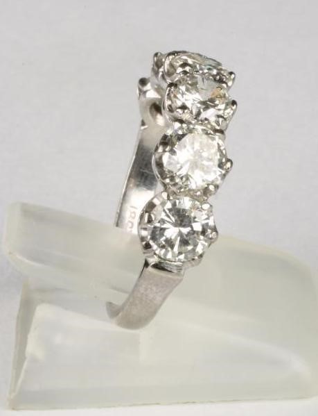 A SIX STONE DIAMOND HALF HOOP RING Image