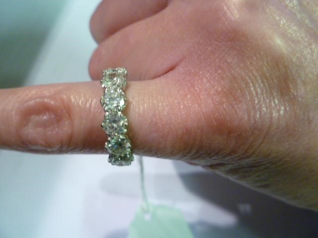 A SIX STONE DIAMOND HALF HOOP RING Image