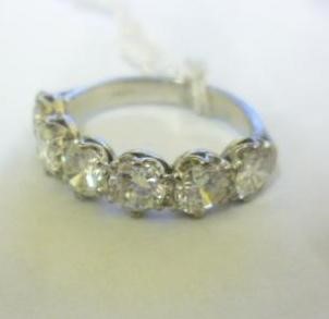 A SIX STONE DIAMOND HALF HOOP RING Image