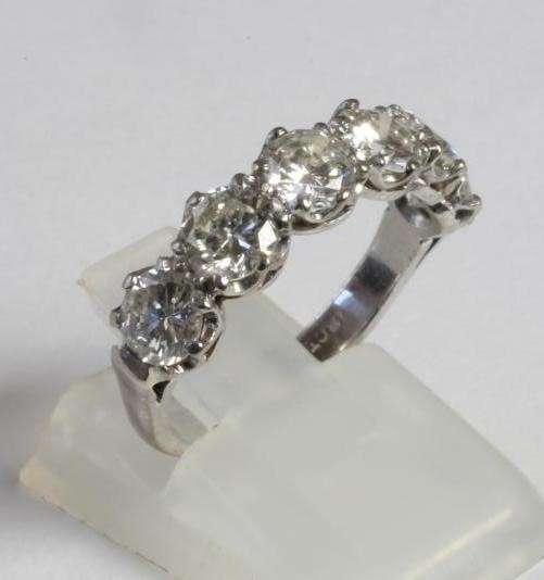 A SIX STONE DIAMOND HALF HOOP RING Image