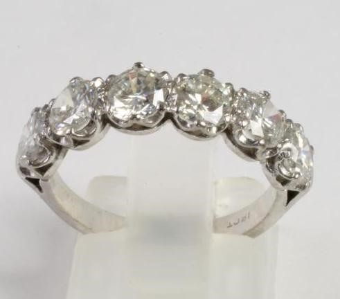 A SIX STONE DIAMOND HALF HOOP RING Image
