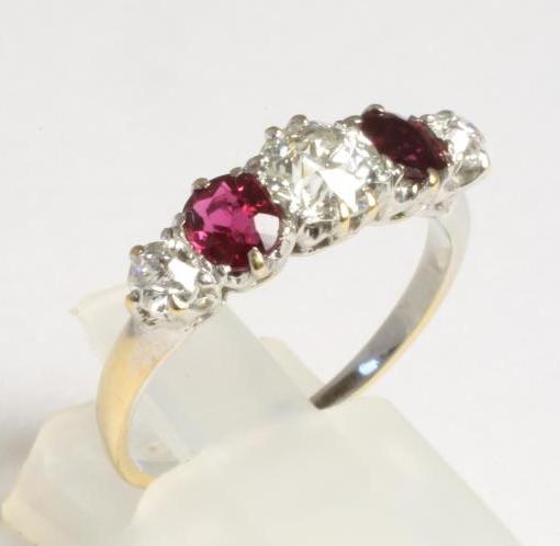 A RUBY AND DIAMOND FIVE STONE RING Image