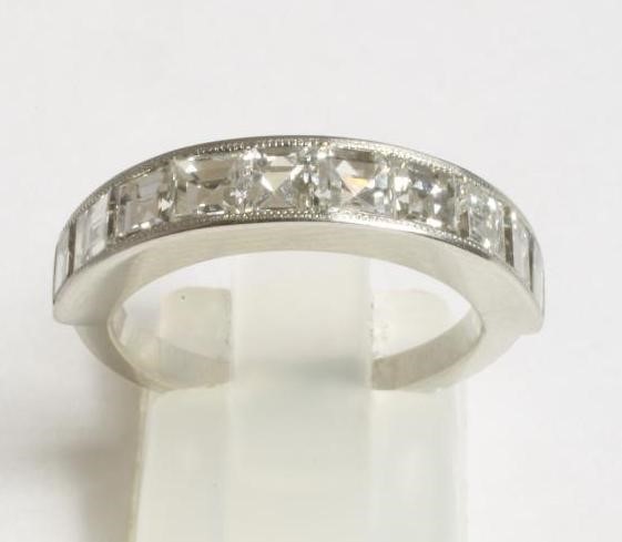 A HALF HOOP DIAMOND RING Image