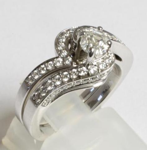 A DIAMOND SET ENGAGEMENT AND MATCHING WEDDING RING Image