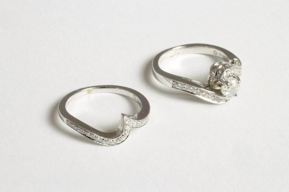 A DIAMOND SET ENGAGEMENT AND MATCHING WEDDING RING Image