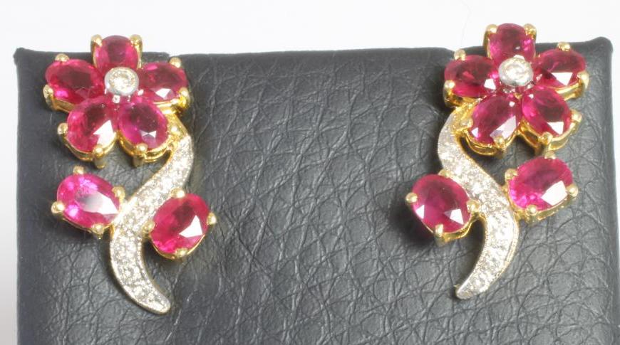 A PAIR OF RUBY AND DIAMOND FLOWER EARRINGS Image