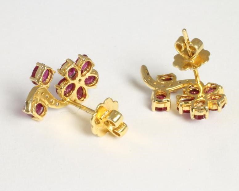 A PAIR OF RUBY AND DIAMOND FLOWER EARRINGS Image
