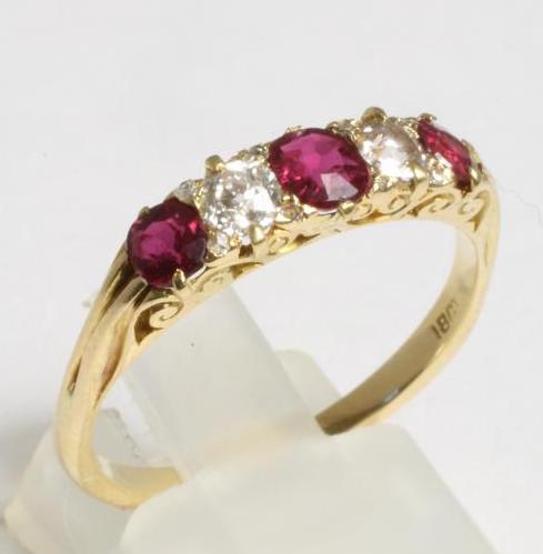 A RUBY AND DIAMOND HALF HOOP RING Image