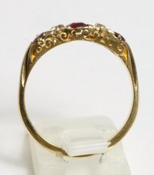A RUBY AND DIAMOND HALF HOOP RING Image