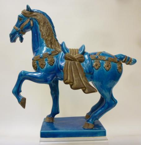 A CHINESE EARTHENWARE "TANG DYNASTY" STYLE HORSE Image