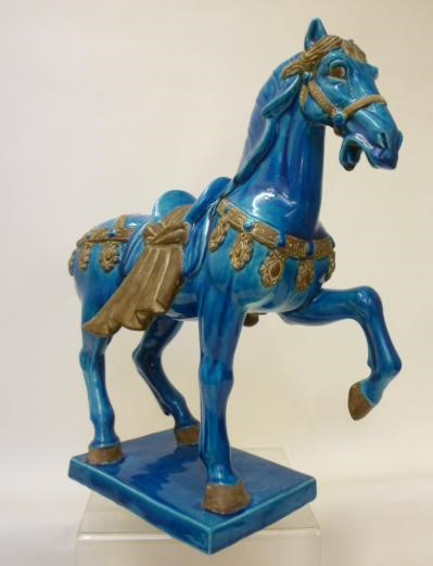 A CHINESE EARTHENWARE "TANG DYNASTY" STYLE HORSE Image
