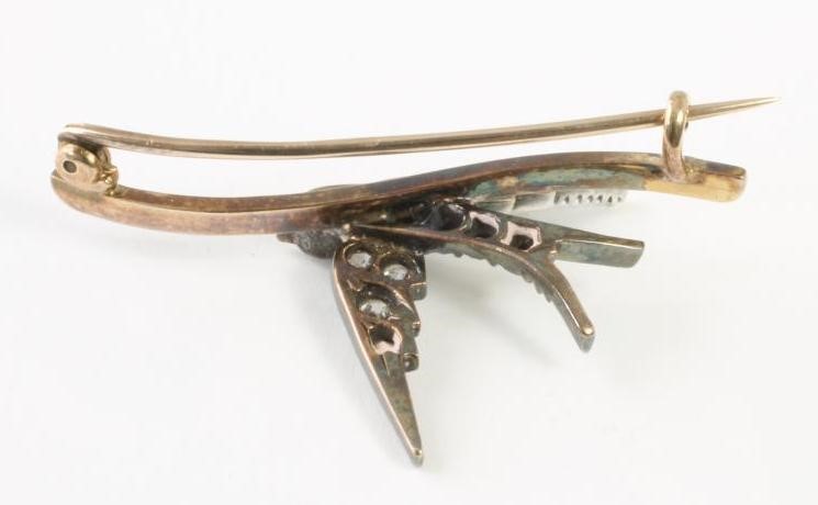 A VICTORIAN DIAMOND BROOCH modelled as a swallow in flight Image