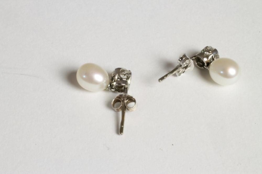 A PAIR OF PEARL AND DIAMOND DROP EARRINGS Image