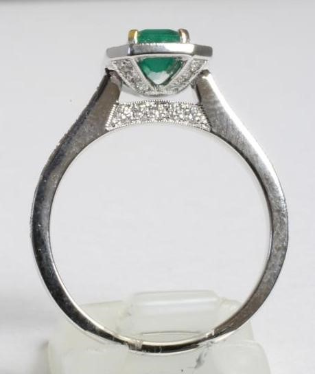 AN EMERALD AND DIAMOND DRESS RING Image