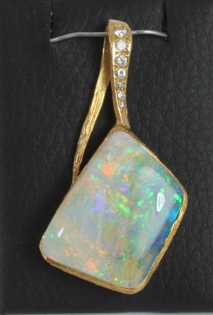 A MODERN OPAL AND DIAMOND PENDANT Image